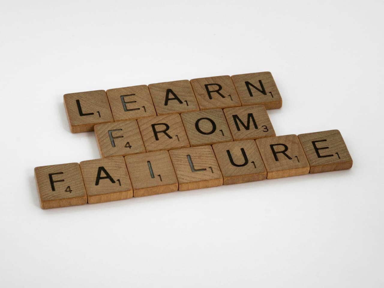 scrabble tiles that spell learn from failure